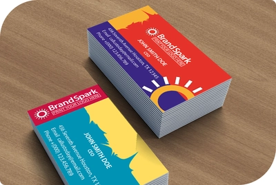two mazes of different coro colre business cards showing its color on a desk