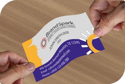 a synthetic flexible business card hanging betwenn two hands 