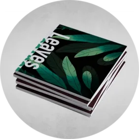 Booklets Printing in a pile in black color with some leaves in green color.