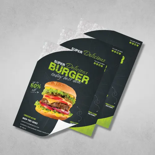 Custom Flyers for Unique Positive Results 10 Stack of burger promotional custom flyers with a vibrant image of a juicy burger, featuring the text 'Super Delicious Burger - today best deal' and contact information for ordering.