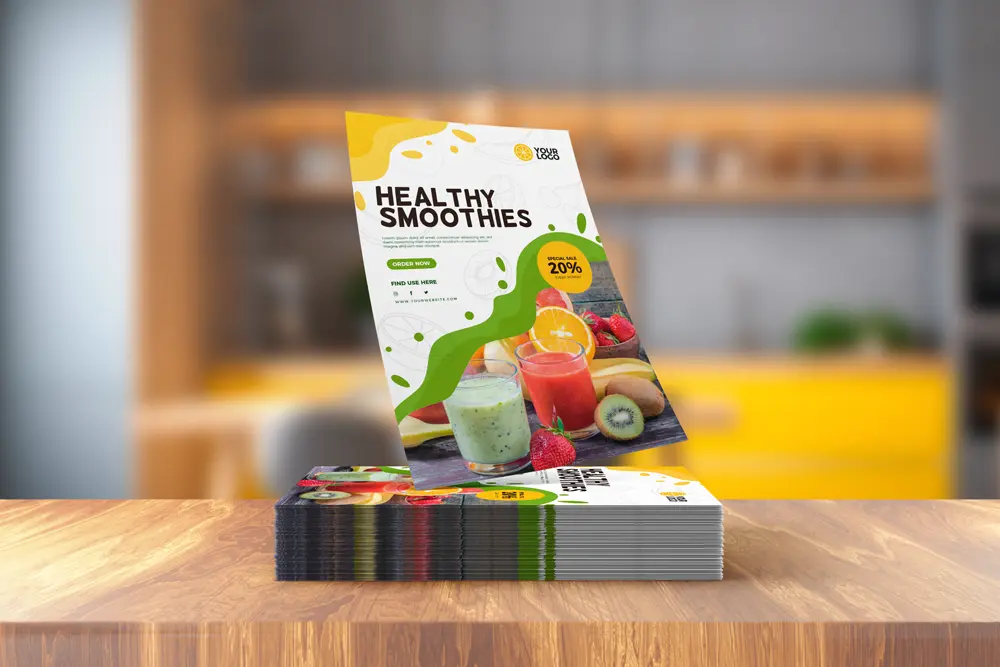 Stack of vibrant smoothie promotional custom flyers with an image of colorful smoothies and fresh fruits, advertising a 'Healthy Smoothies' special offer with a 20% discount.