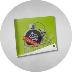 Black Friday promotional vinyl banners printing displayed on a wall, featuring bold text and eye-catching graphics.