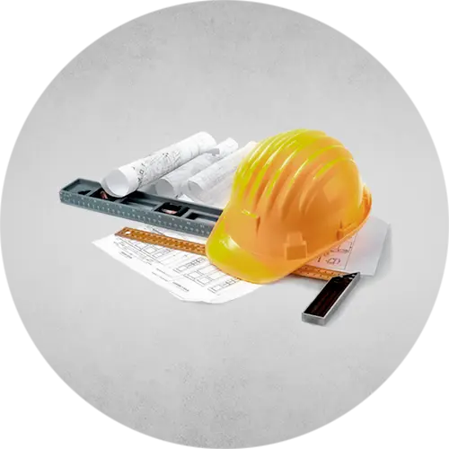 A construction helmet alongside construction paper and blueprints for contractors and engineers, ready for planning.