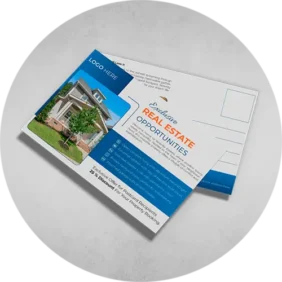 Some Postcards Printing of a real estate opportunities in blue and orange colors with a house photo